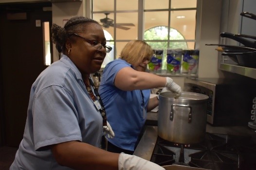City employees making a meal for staff